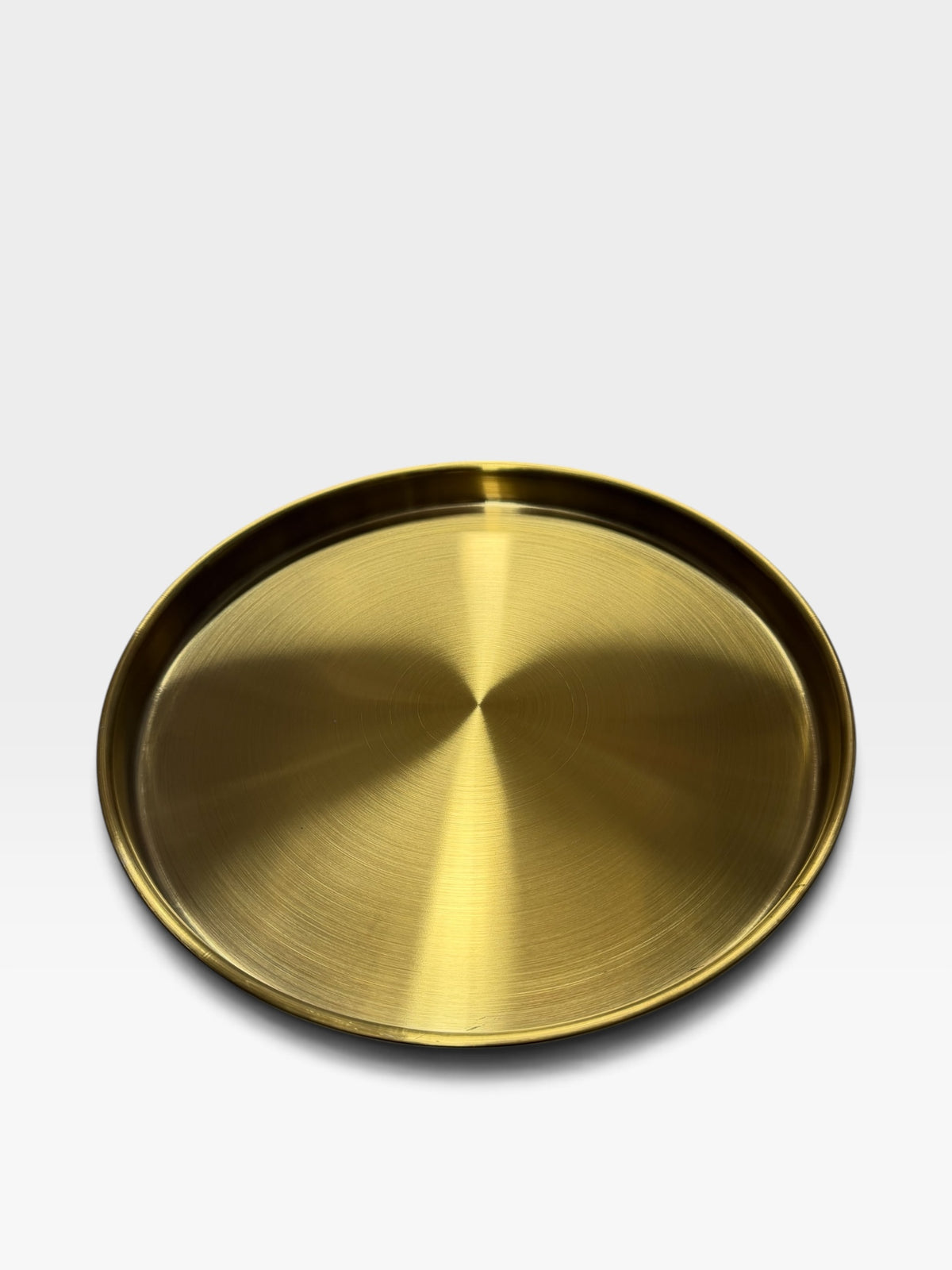 TP BEAUTY SUPPLY PTY LTD round brushed gold metal serving tray with a radial texture for home decor and organisation.